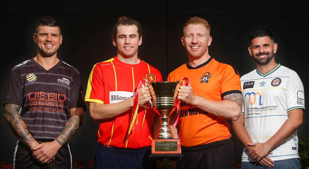 READY: Port Kembla Pumas' Adrian Perossa (left), Wollongong United's Maty Brennan, Dandaloo's Jakob McCoy and Albion Park City coach Daniel Garcia with the Fraternity Cup trophy. Picture: Adam McLean