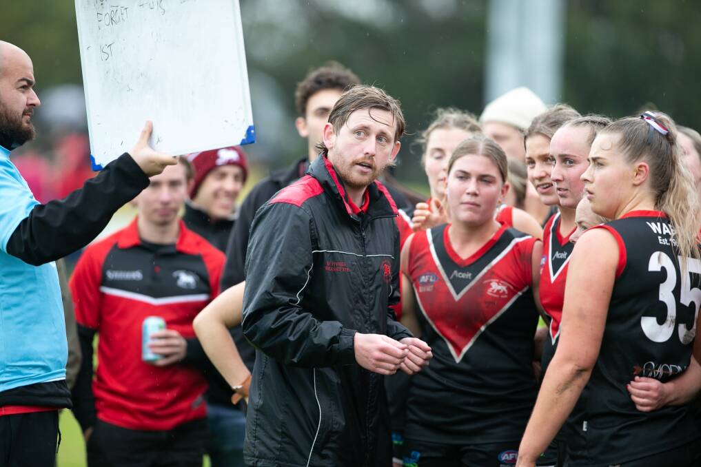 Ben Hyndes runs through instructions to his Lions women's players during a game. Picture - Supplied