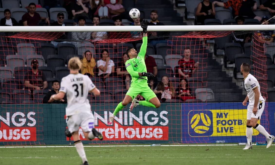 ON TARGET: Macarthur FC gloveman Adam Federici jumps high to save a goal against Western Sydney Wanderers on Wednesday night. Picture: Steven Markham/Speed Media/Icon Sportswire via Getty Images