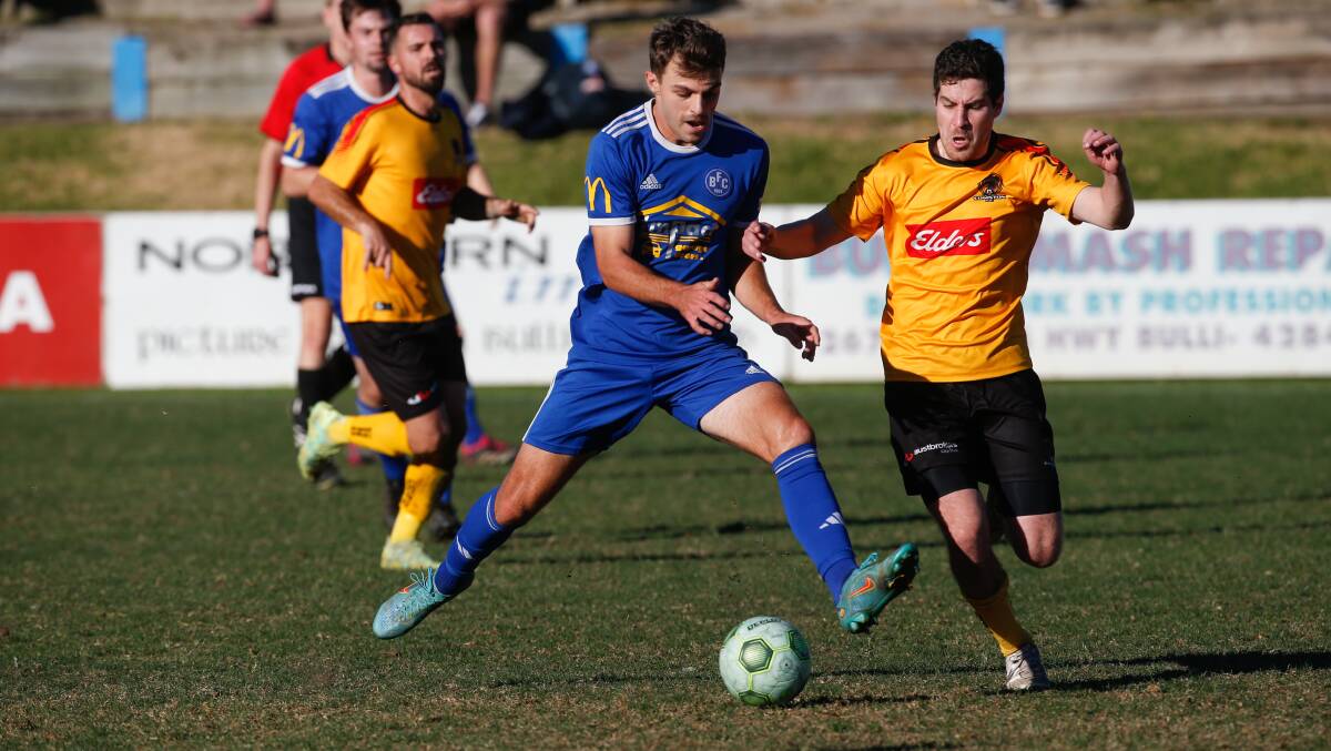 Bulli's Lewis Grimshaw (left) produced a late equaliser for his side against Port Kembla on Saturday. Picture by Anna Warr