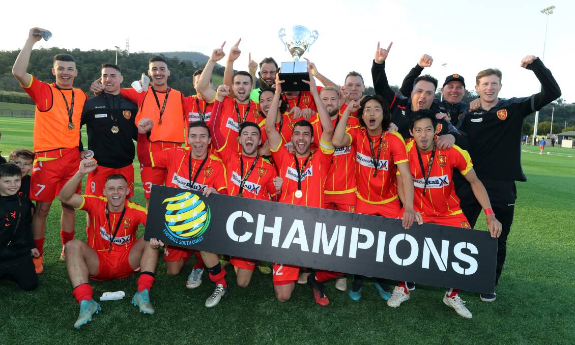 DELIGHT: Wollongong United players celebrate after winning the Bert Bampton Cup on Sunday. Picture: Robert Peet
