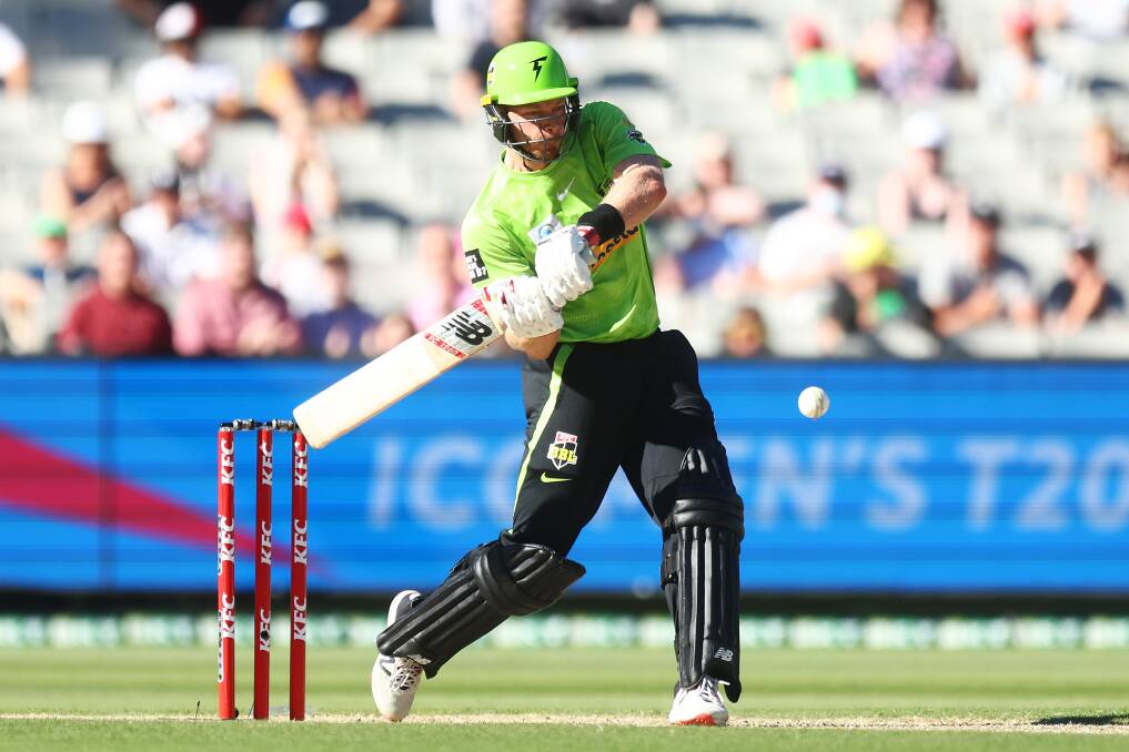 ON TARGET: Nathan McAndrew prepares to smash the ball while batting for the Sydney Thunder on Wednesday. Picture: Mike Owen/Getty Images