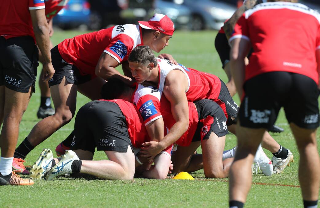 Connor Muhleisen tackles a fellow Dragon during a pre-season training session at WIN Stadium. Picture by Robert Peet