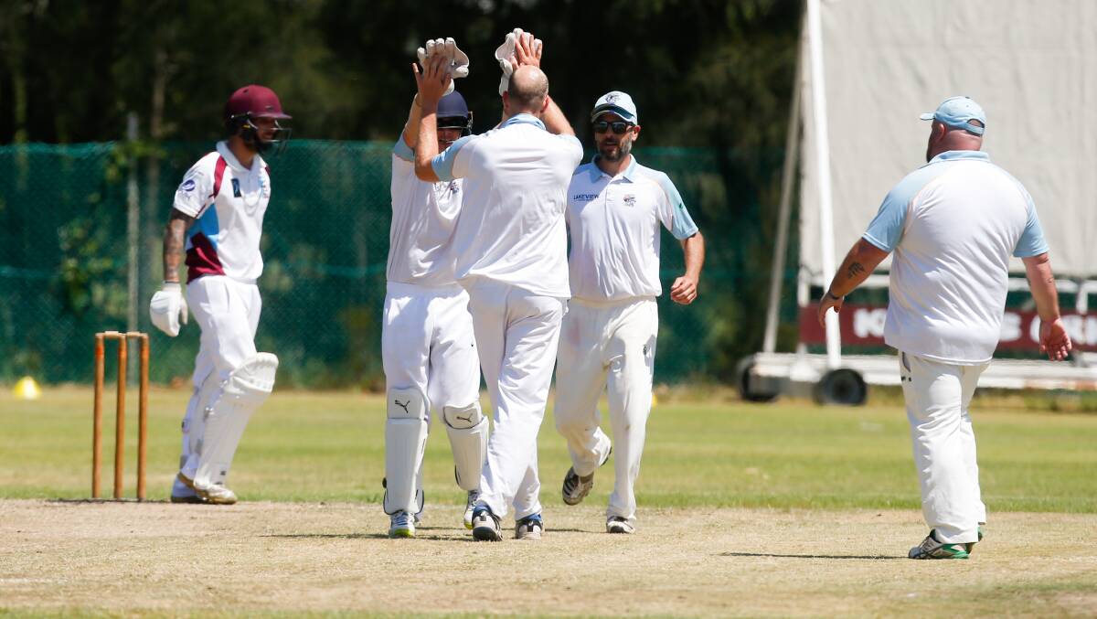 HAPPY DAYS: Oak Flats players celebrate after Kookas batsman Zac Jurd is caught behind by wicketkeeper Sam McClennan. Picture: Anna Warr