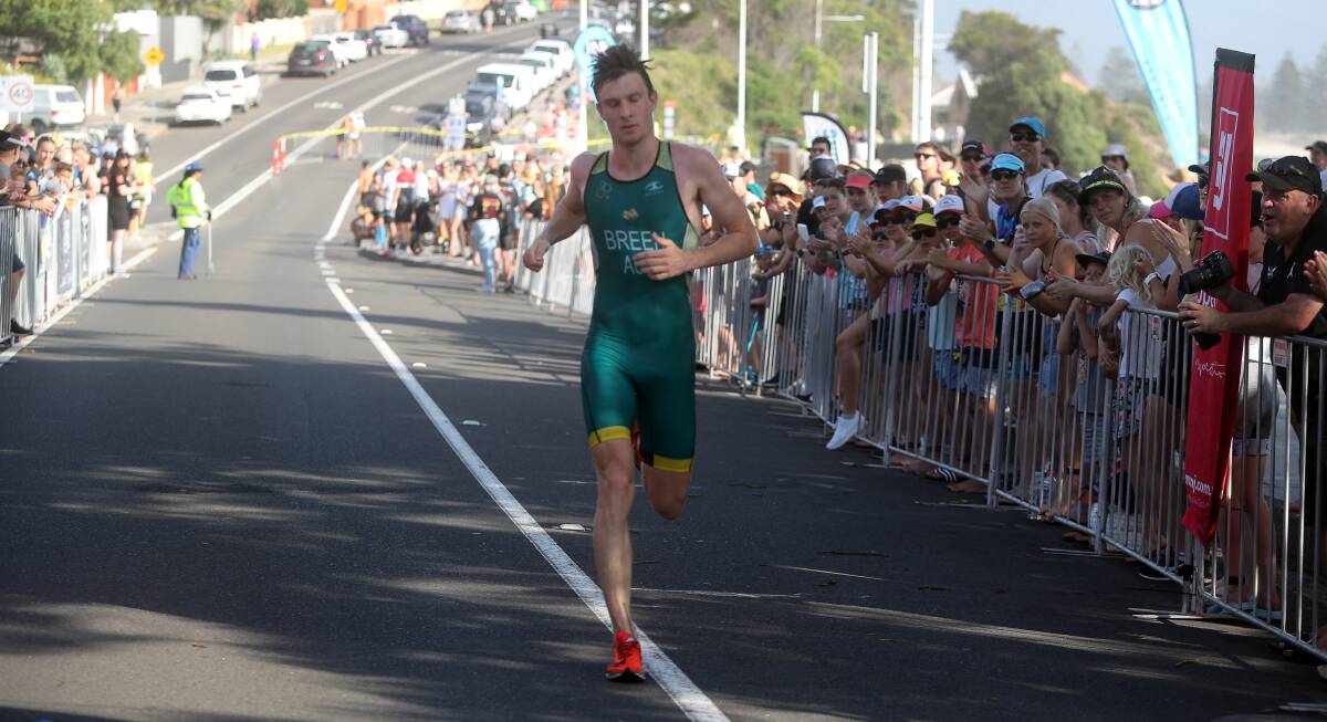 WINNER: Nathan Breen on the final stretch to take out the 2019 Aquathon men's title. Picture: Robert Peet