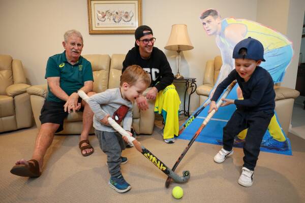 FAMILY: Ian and Kieran Govers, with Kieran's sons Toby, 2, and Leo, 4, and a cardboard cut-out of Kookaburras star Blake Govers. Picture: Adam McLean