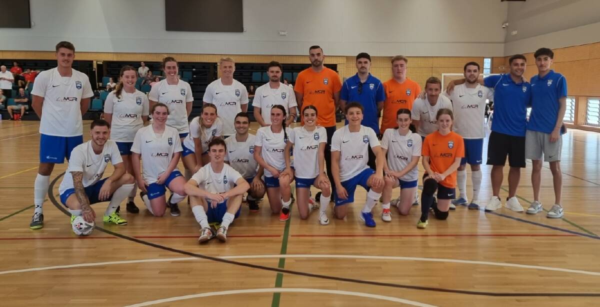South Coast Taipans men's and women's players and coaches join together after winning two NSW Futsal Premier League championships over the weekend. Picture - South Coast Taipans