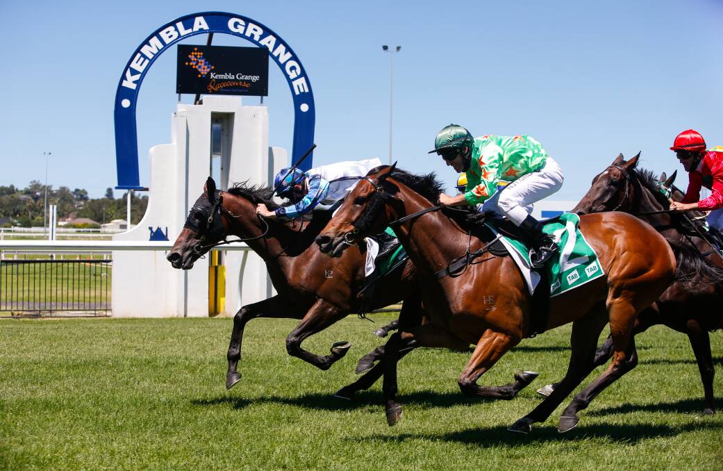 POWERING AHEAD: Explosive Jack (inside), ridden by Brodie Loy, wins the Benchmark 64 Handicap (over 2400m) at Kembla Grange on Saturday. Picture: Anna Warr