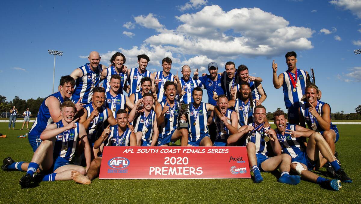 Figtree players celebrate after winning the Men's Premier Division title on Saturday. Picture: Anna Warr