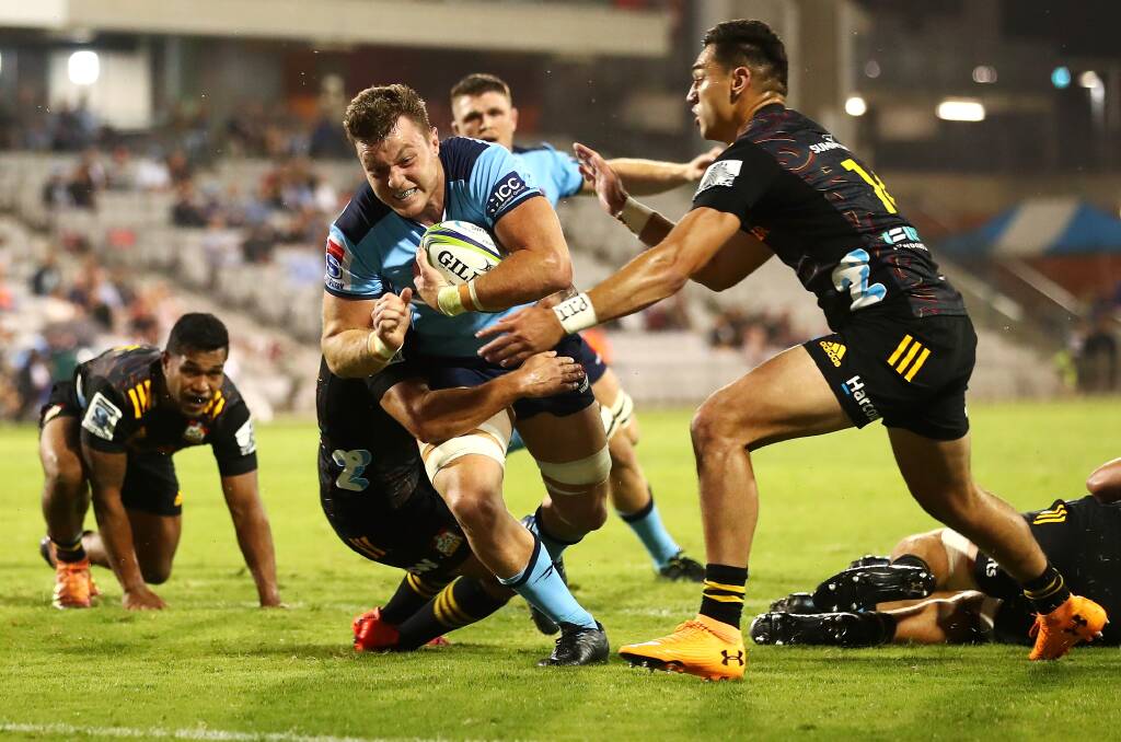 IN FOCUSED: Waratahs number eight Jack Dempsey dives over to score a try against the Chiefs in Wollongong last year. Picture: Cameron Spencer/Getty Images