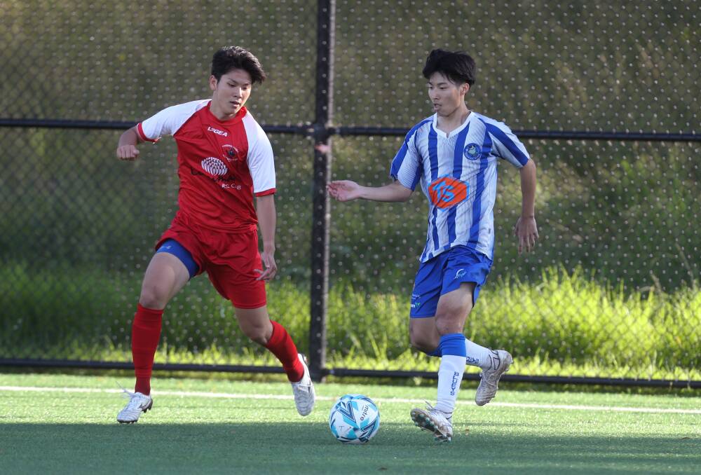 SET: Rangers player Masamune Kobayshi (left) chases after the ball earlier this year. Picture: Robert Peet