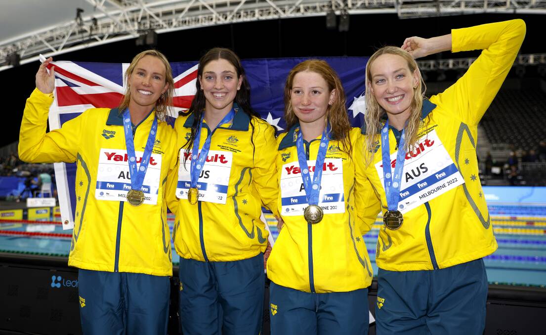 Australia's gold medal-winning relay team (from left) Emma McKeon, Meg Harris, Mollie O'Callaghan and Madison Wilson during the medal ceremony for the womens 4x100m freestyle final in Melbourne on Tuesday night. Picture by Daniel Pockett/Getty Images
