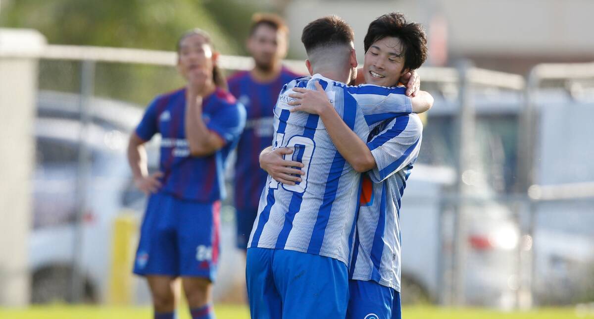 DELIGHT: Takumi Ofuka (right) celebrates with his teammate after Tarrawanna scored their fourth goal on Saturday. Picture: Anna Warr