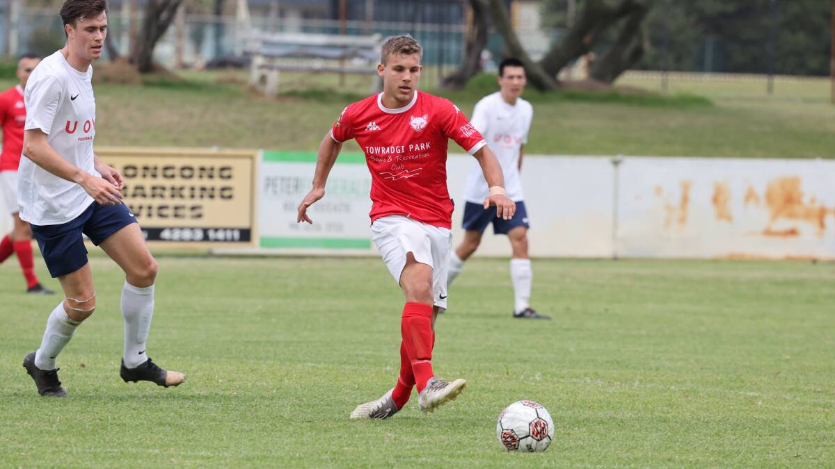 Fernhill player David Kotrc keeps a close eye on the ball during a District League match against University of Wollongong last month. Picture by Robert Peet