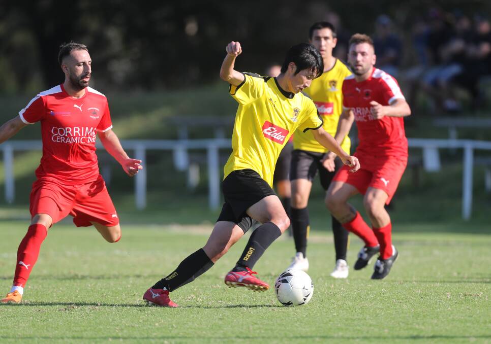 ON THE BALL: Takayuki Kayano looks to pass to a Coniston teammate during an Illawarra Premier League game against the Rangers last year. Picture: Robert Peet
