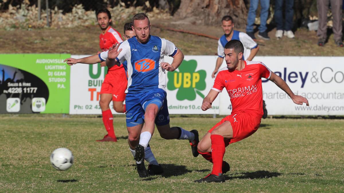 IN FORM: Corrimal's Paul Guido (right) scored two goals for the Rangers on Sunday. Picture: Robert Peet