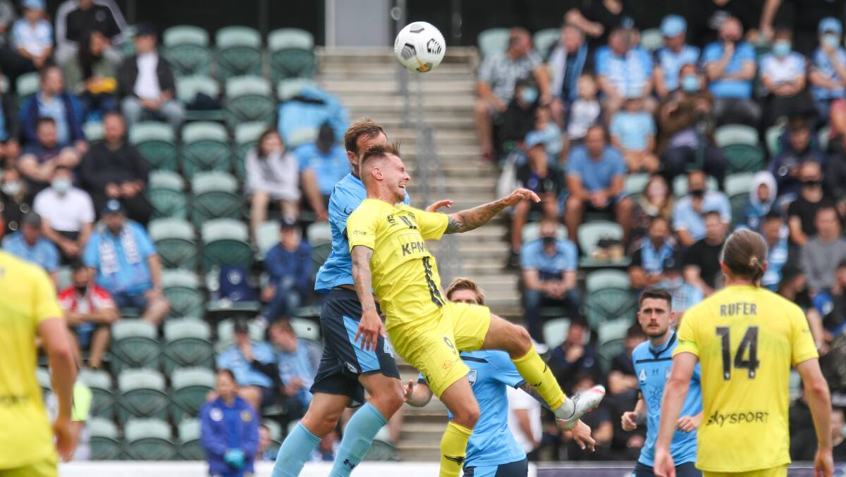 David Ball challenges for the ball against Sydney FC earlier this season at WIN Stadium. Picture: Adam McLean