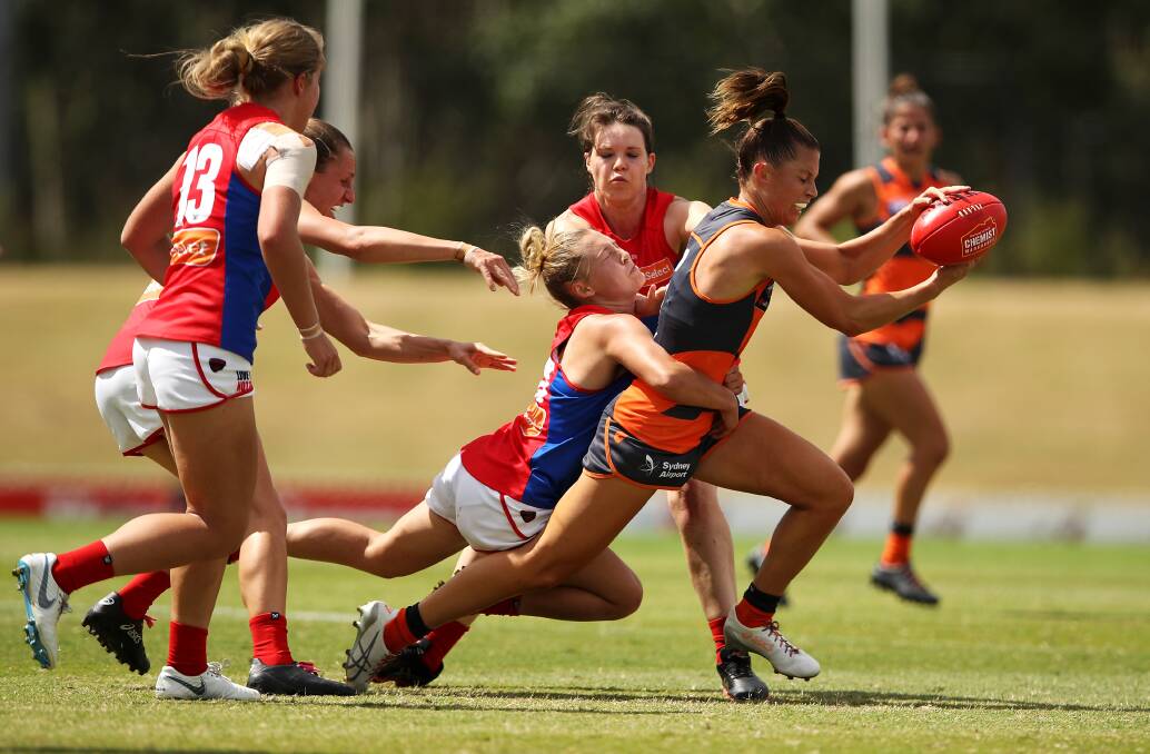 HARD AT WORK: Taylah Davies aims to burst away from a Demons defender. Pictures: Mark Kolbe/Getty Images and South Coast Blaze