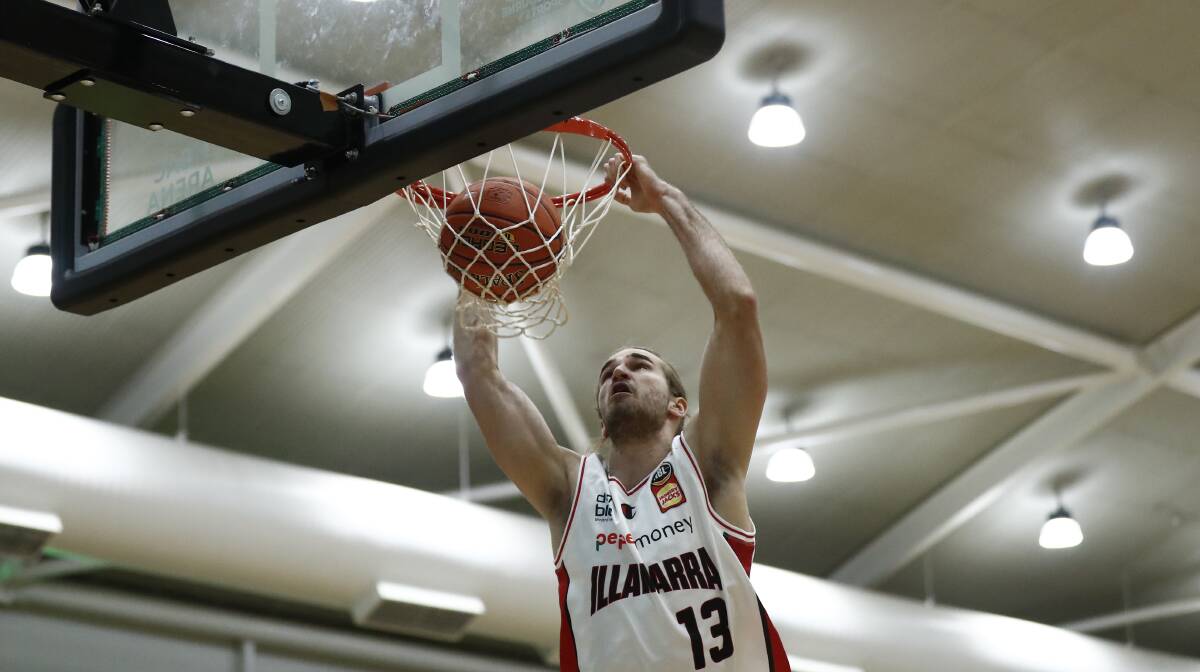 Sam Froling of the Hawks dunks against the Phoenix on Monday night. Picture: Darrian Traynor/Getty Images