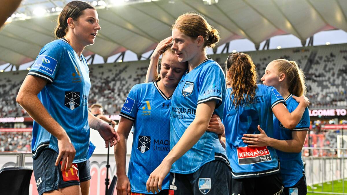 Caley Tallon-Henniker shares a hug with teammate Cortnee Vine after Saturday night's win over Western Sydney Wanderers. Picture - Sydney FC