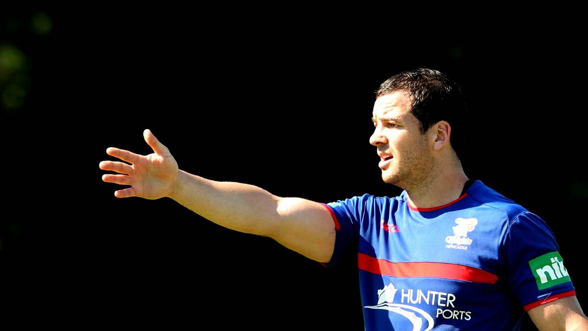 Jarrod Mullen gives some instructions to a teammate at a Knights training session in 2013. Picture by Ryan Osland