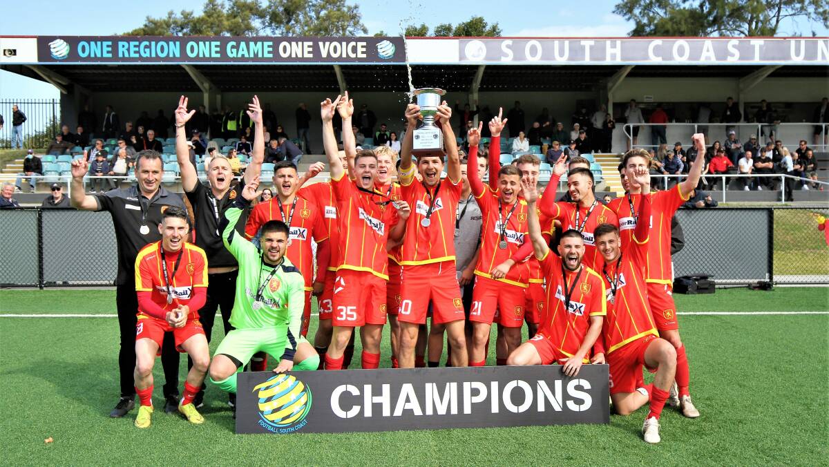 CHAMPAGNE FOOTBALL: Wollongong United players and coaches celebrate winning the Youth Cup on Sunday afternoon. Picture: Pedro Garcia