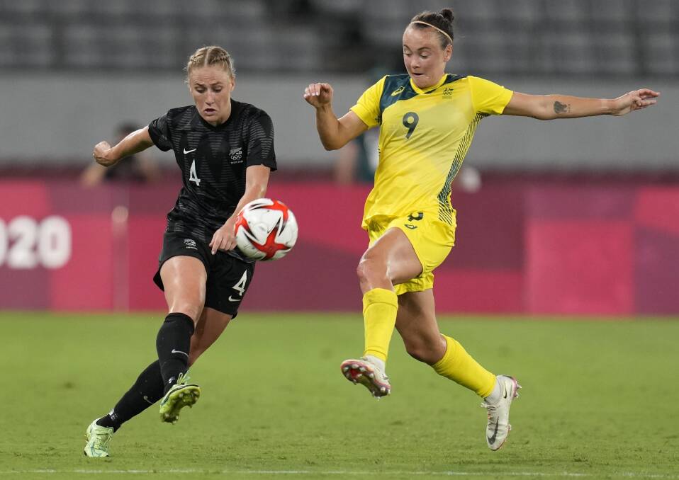 ON TARGET: Caitlin Foord battles for possession with New Zealand's CJ Bott during Thursday night's clash in Tokyo. Picture: AP Photo/Ricardo Mazalan