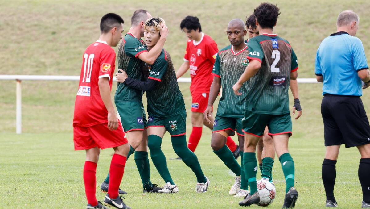 Bellambi's Gaku Yamamoto celebrates with teammates after scoring a goal against Warilla in round one. Picture by Anna Warr