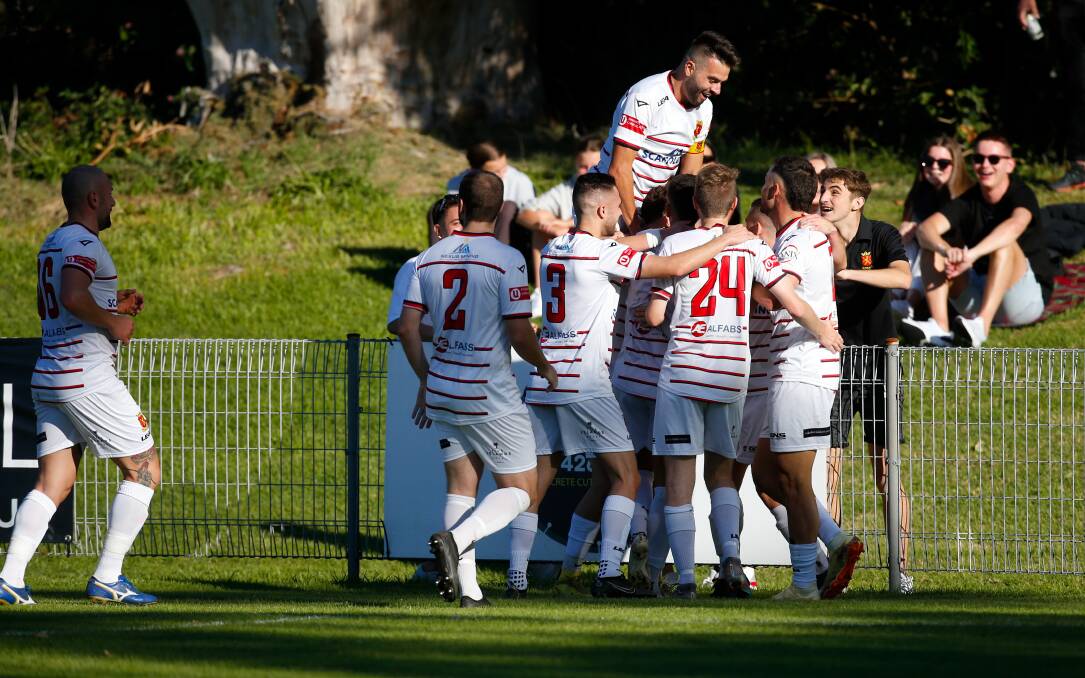 The Lions celebrate after scoring a goal against Corrimal at Memorial Park in May. Picture by Anna Warr