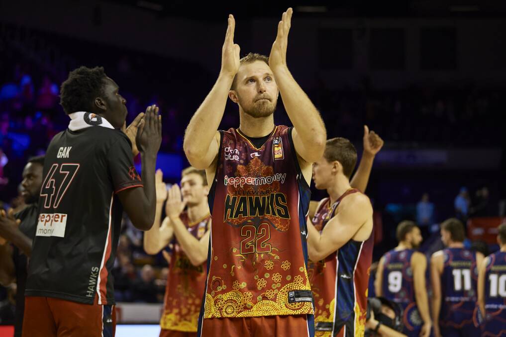 GRATEFUL: Hawks veteran Tim Coenraad celebrates after his side's recent win over the 36ers at the WEC. Picture: Brett Hemmings/Getty Images