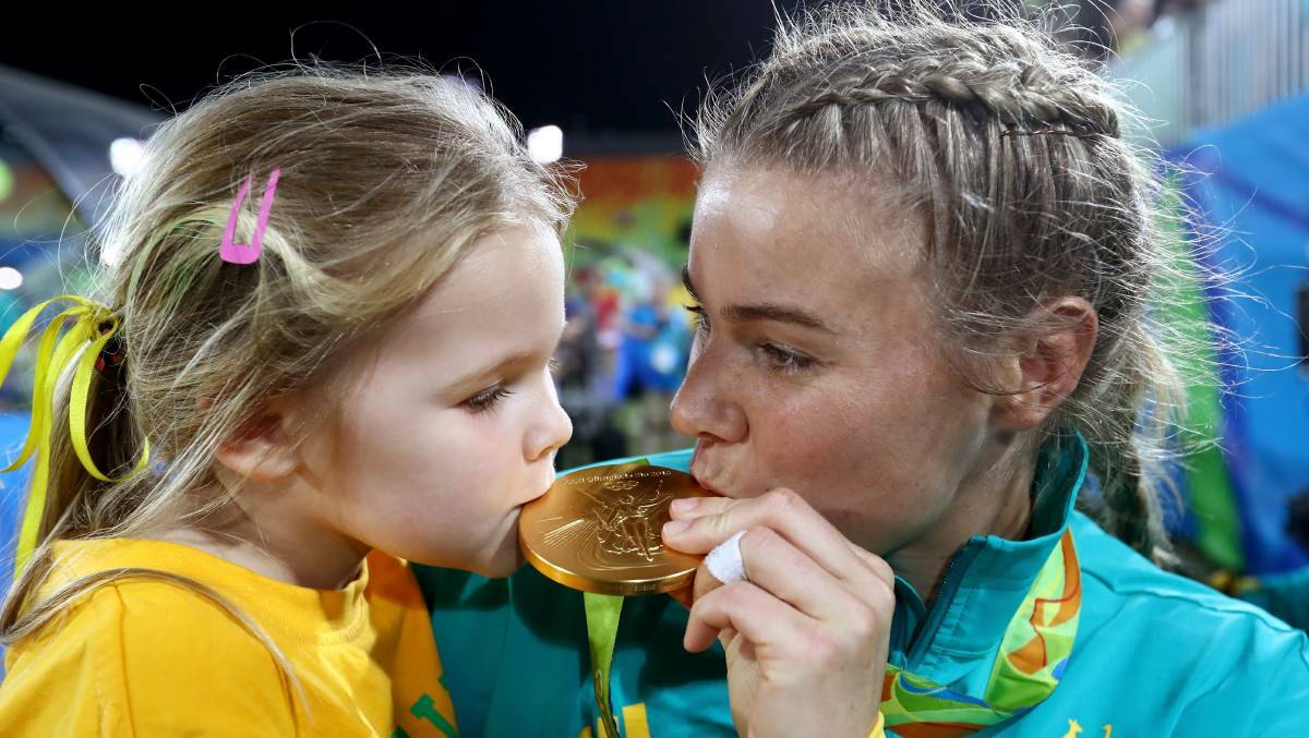 Bulli's Olympics Rugby Sevens player Nicole Beck with daughter Sophie after winning gold at Rio in 2016. Picture: Getty Images