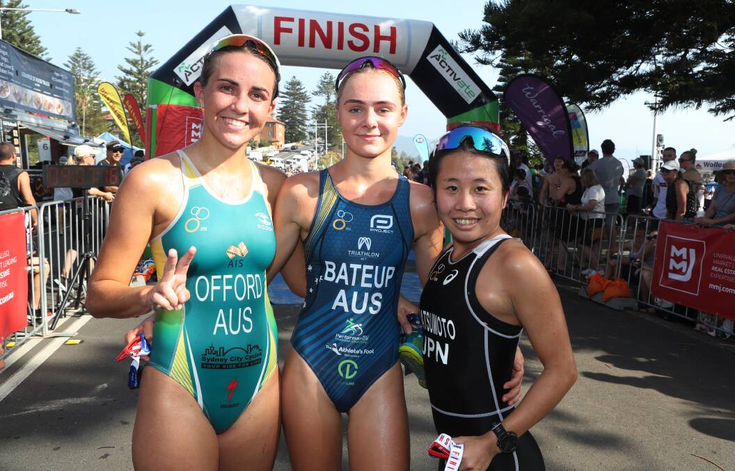 TOO GOOD: Canberra teen Chloe Bateup (centre) celebrates winning back-to-back Australia Day Aquathon women's titles on Sunday. Picture: Robert Peet