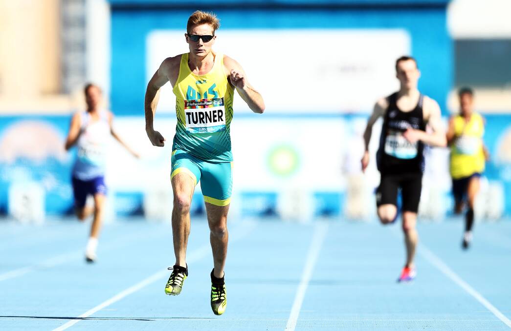 POWERFUL: Wollongong's James Turner dashes away to win the T36 400m final in a world record time in Dubai on Thursday night. Picture: Bryn Lennon/Getty Images