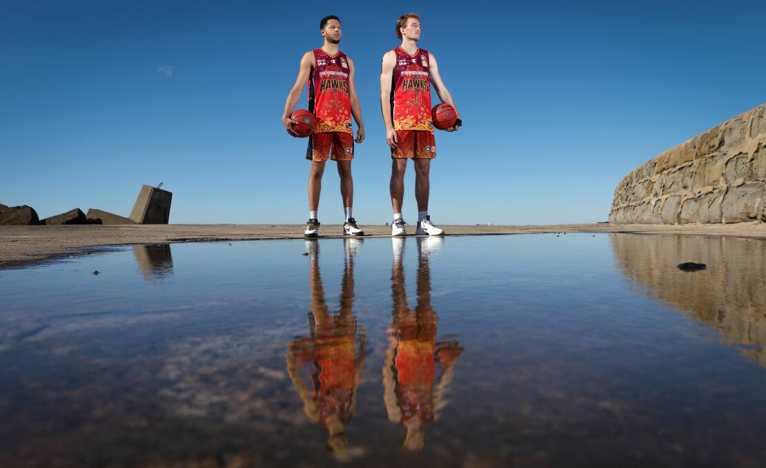 PROUD: Illawarra Hawks players Tyler Harvey and Daniel Grida wearing the team's indigenous jerseys. Picture: Adam McLean