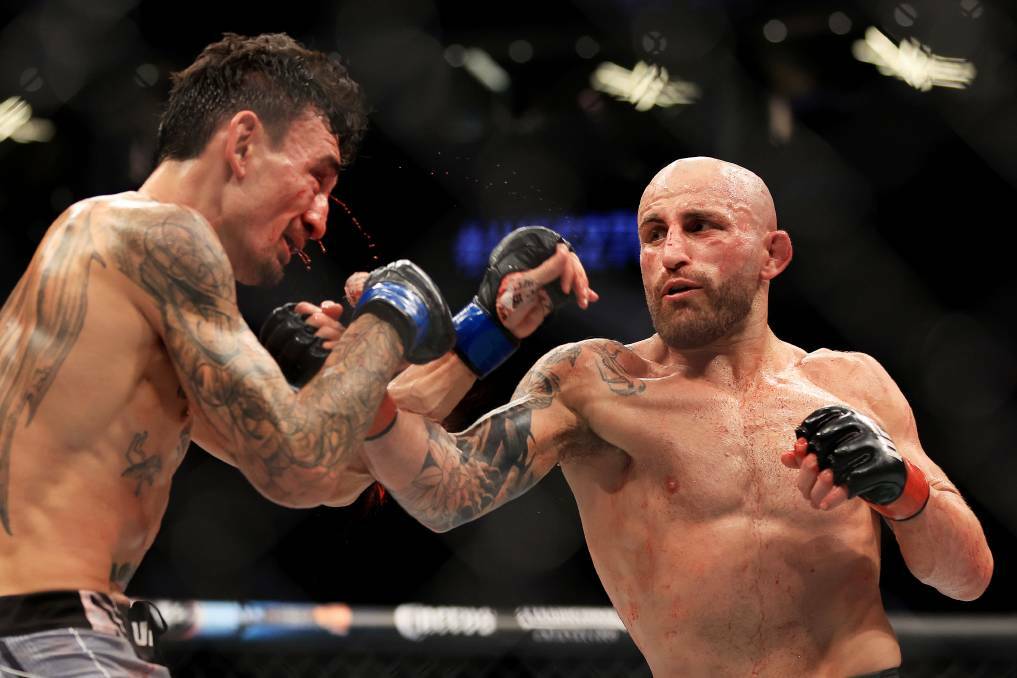 OUCH: Alex Volkanovski lands one of many blows on Max Holloway on Sunday. Picture: Getty Images