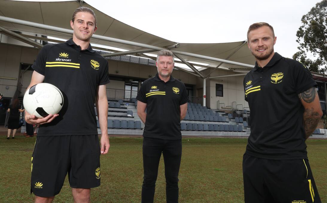 Wellington Phoenix players Alex Rufer (left) and David Ball with coach Ufuk Talay at the University of Wollongong campus in November 2020. Picture by Robert Peet