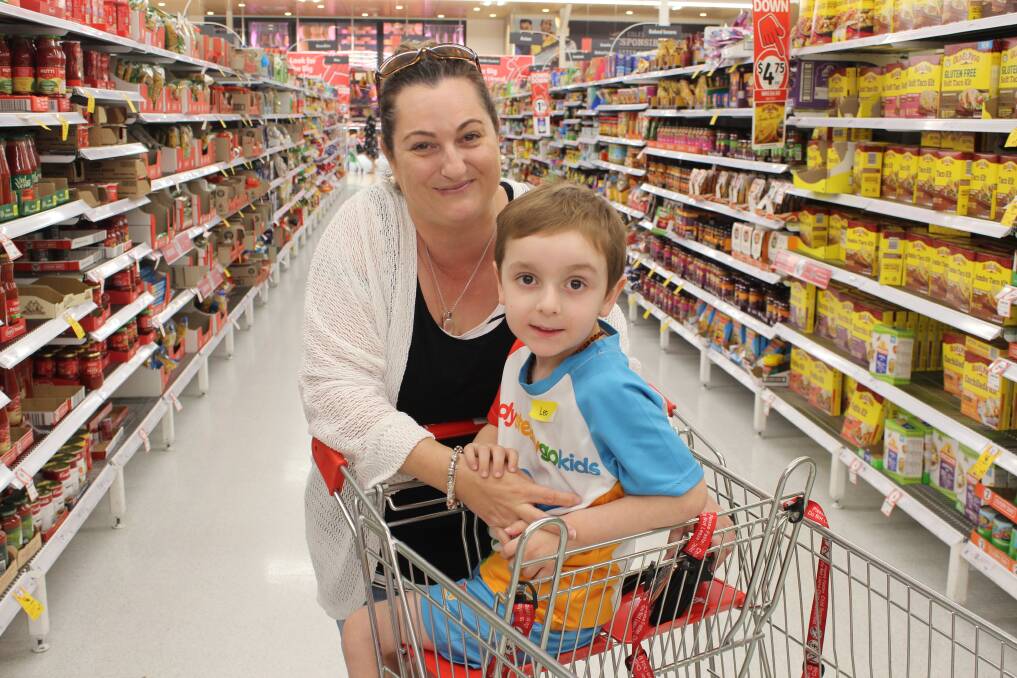 Cindy Reseigh says 'Quiet Hour' at Coles will make shopping easier for her son Leo who has autism. Photo: Joshua Bartlett
