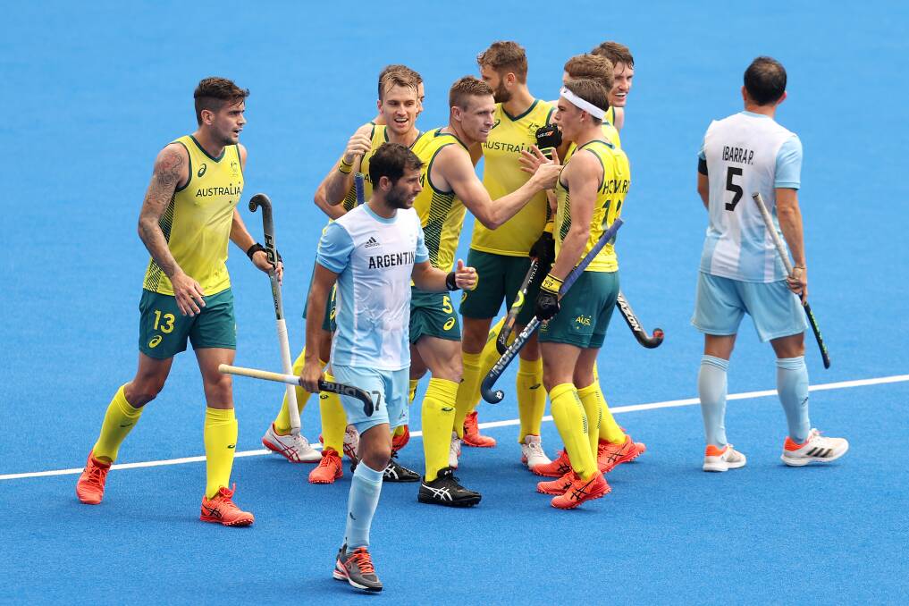 PARTY TIME: Blake Govers (left) and his Australian teammates celebrate after scoring their fourth goal against Argentina on Tuesday in Tokyo. Picture: Francois Nel/Getty Images