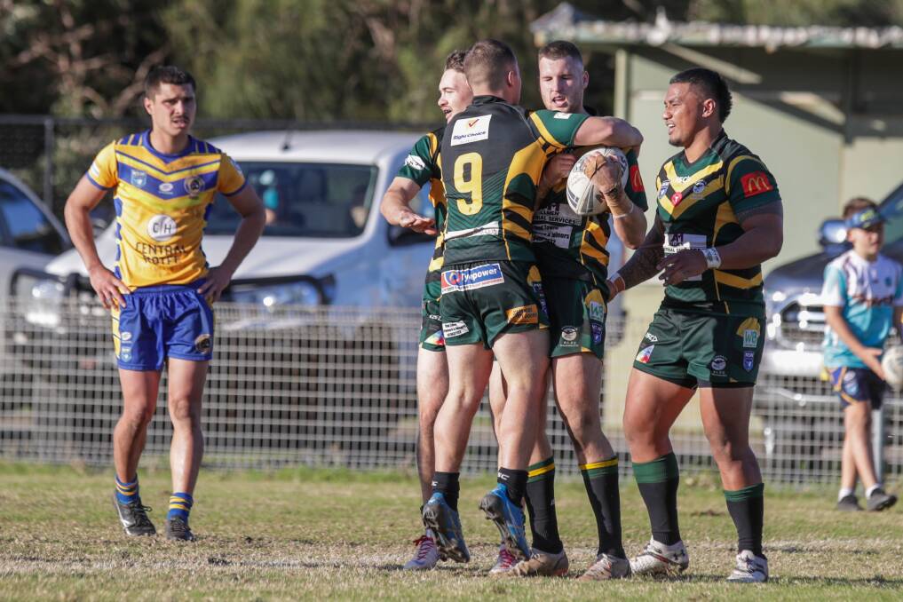 DELIGHT: Stingrays players celebrate after Matthew Delbanco scores a try on Sunday. Picture: Adam McLean