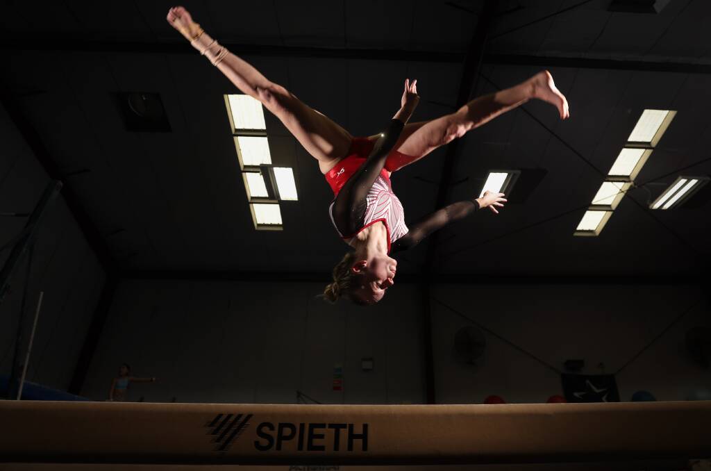 Caitlin Jones showcasing her talent on the beam. Picture by Adam McLean