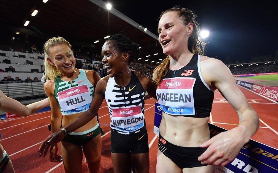 Albion Park's Jessica Hull (left) celebrates with winner Faith Kipyegon after an incredible women's 1500m race at the Doha Diamond League. Picture - Athletics Australia