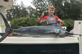 Impressive: 10-year-old Cooper Noferi is beside himself with excitement after capturing his first black marlin last Monday.