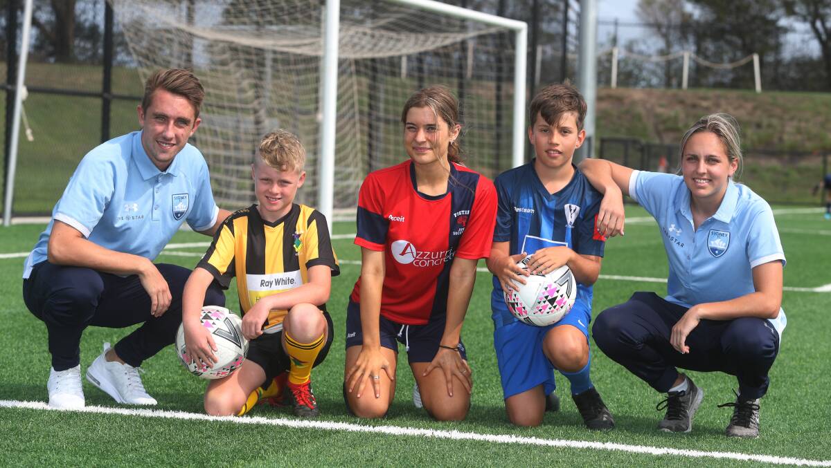 TOGETHER: Sydney FC's Joel King and Mackenzie Hawkesby with Illawarra juniors Joe Wilson, Grace Hilton and Taite Hindmarsh in 2020. Picture: Robert Peet