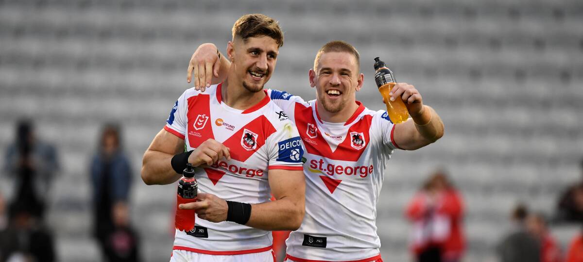 HAPPY DAYS: Dragons centre Zac Lomax (left) celebrates after a win with teammate Matt Dufty. Picture: Grant Trouville/NRL Imagery