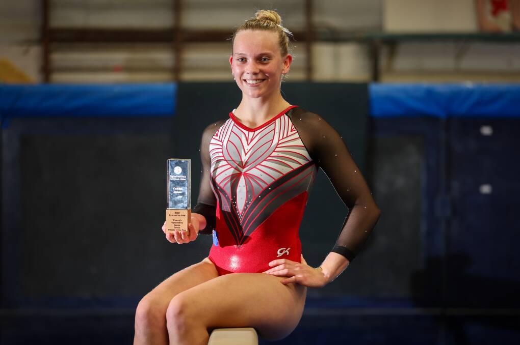 Austinmer teenager Caitlin Jones proudly shows off her prestigious Gymnastics NSW award at Wollongong City Gymnastics. Picture by Adam McLean
