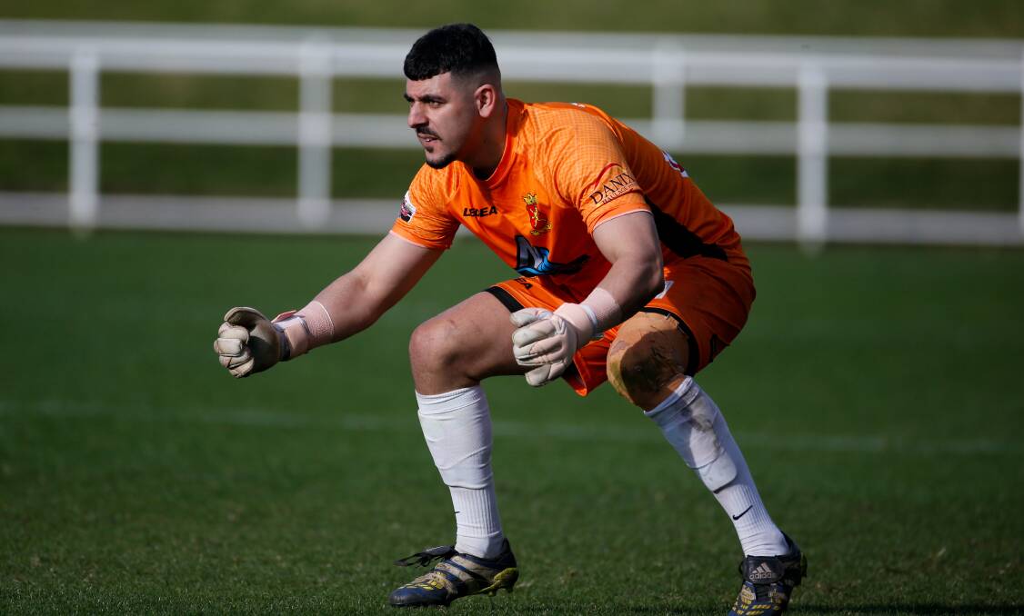 Cringila goalkeeper Nikola Ristevski has his eyes firmly focused on the prize during a Premier League match earlier this year. Picture by Anna Warr