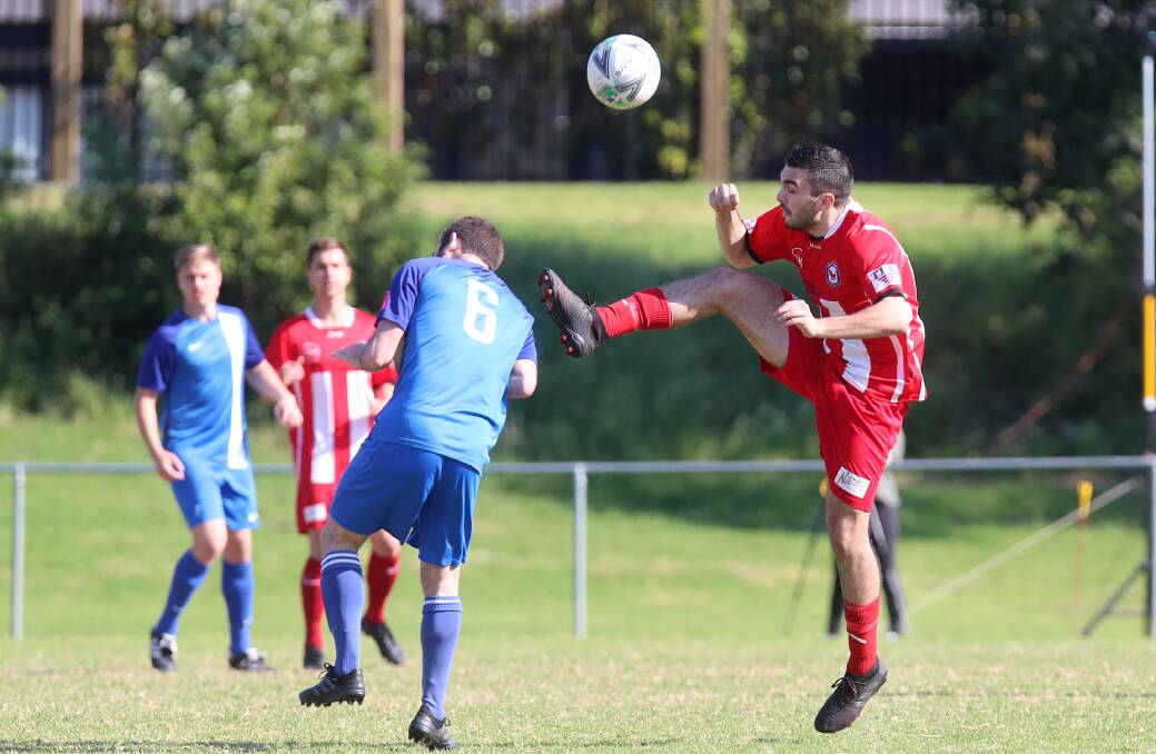 Oak Flats player Kyle Del looks to trap the ball during a recent District League game against Thirroul. Picture: Sylvia Liber