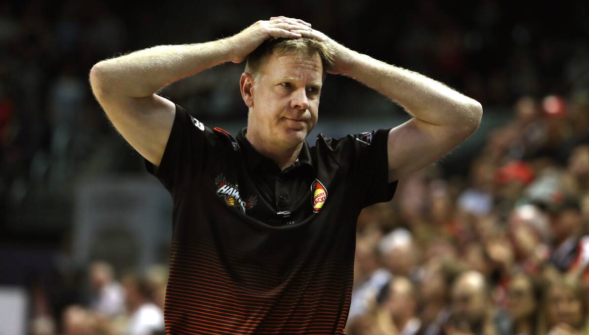 ROLLERCOASTER: Hawks coach Matt Flinn rides the highs and lows during Illawarra's victory over Cairns Taipans on Monday night. Picture: Sylvia Liber