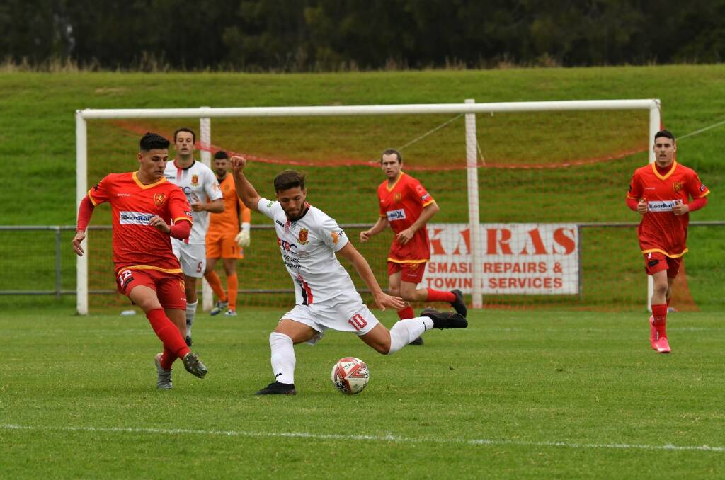 MOVING FORWARD: Cringila's Stefano Di Marino prepares to pass the ball during a recent Premier League game against Wollongong United. Picture: Richie Wagner