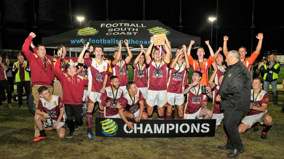 Picton players celebrate after winning the District League's Youth Grade title on Friday night. Picture: Pedro Garcia